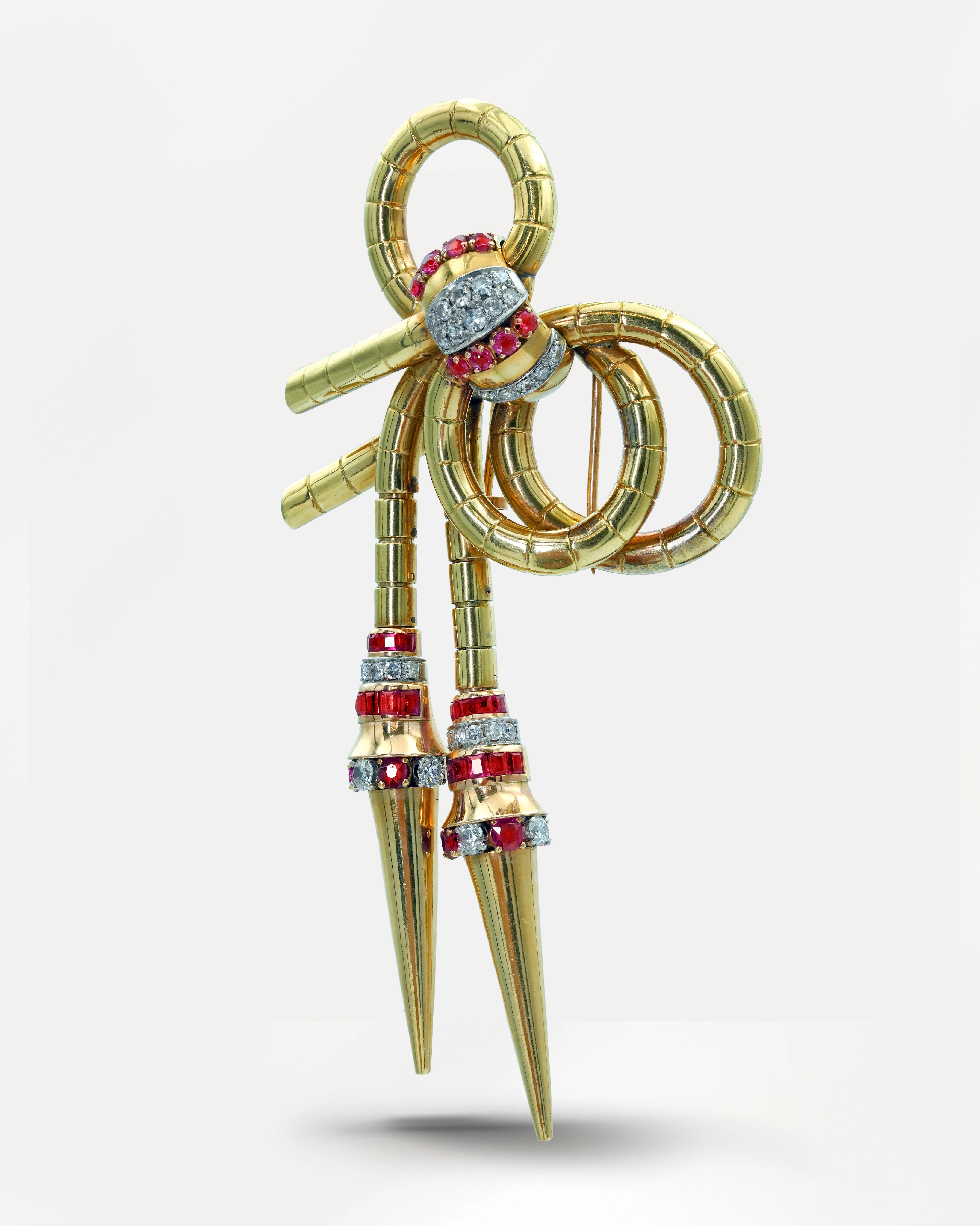 Long Victorian bow-tie ruby and diamond brooch, set in 18K yellow gold